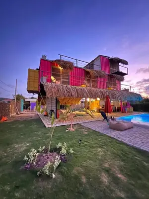 a house with a pool in front of it at KITE en Mojarra Beach Habitación privada vista al mar in Salina de Rey