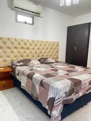 a bedroom with a large bed with a large headboard at Cabaña Tolu Sucre in Santiago