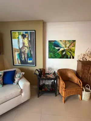 a living room with a couch and a chair at Beachfront Luxury Apartment Cartagena in Cartagena de Indias