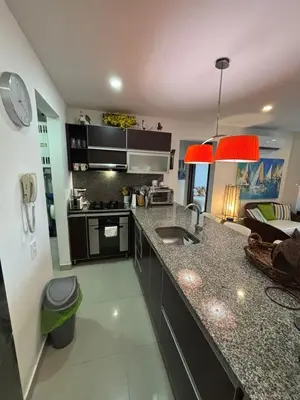 a kitchen with a sink and a counter top at Beachfront Luxury Apartment Cartagena in Cartagena de Indias