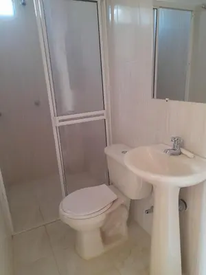 a bathroom with a toilet and a sink and a shower at Cabaña frente al mar de San Antero in San Antero