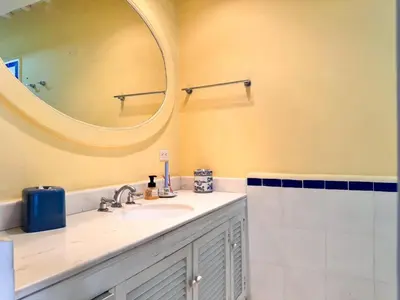 a bathroom with a sink and a mirror at Casa azul in Cartagena de Indias