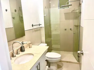 a bathroom with a toilet and a glass shower at Hermoso apartamento MORROS EPIC in Cartagena de Indias