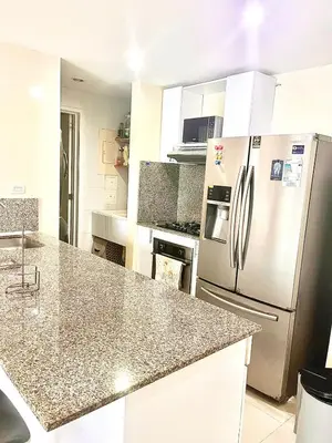 a kitchen with a refrigerator and a counter top at Hermoso apartamento MORROS EPIC in Cartagena de Indias