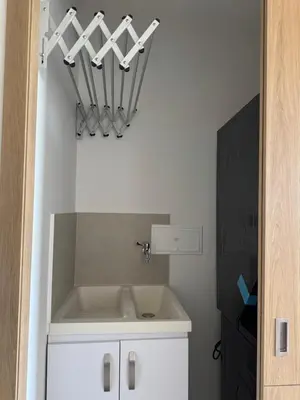 a bathroom with a sink in a room with a wall at Baia Kristal 5I in Estación El Salto
