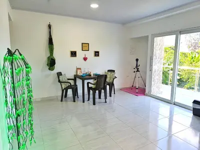 a dining room with a table and chairs at Apartamento cerca a la playa in El Porvenir