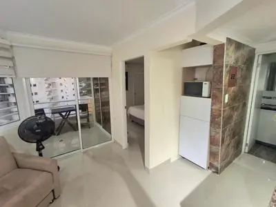 a living room with a couch and a microwave at Cabrero Beach 1213 in Cartagena de Indias