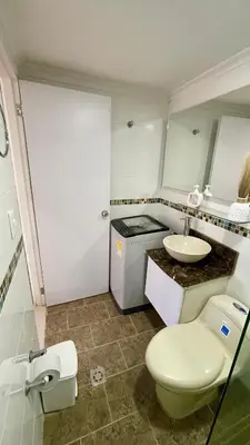 a small bathroom with a sink and a toilet at Cabrero Beach 1213 in Cartagena de Indias