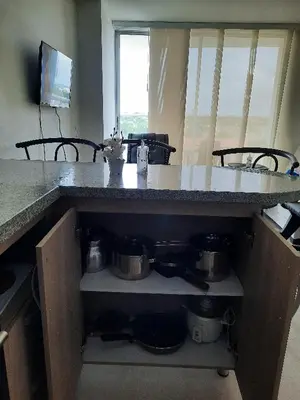 a kitchen with a counter with pots and pans at Apartamento completo in Cartagena de Indias