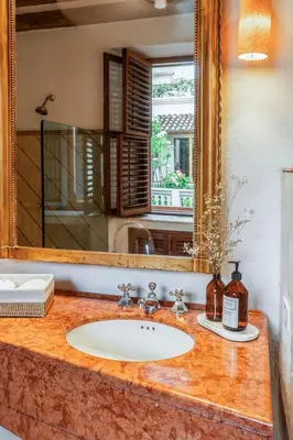 a bathroom counter with a sink and a mirror at Casa Trujillo in Cartagena de Indias