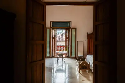 an open door to a room with a table and chairs at Casa Trujillo in Cartagena de Indias