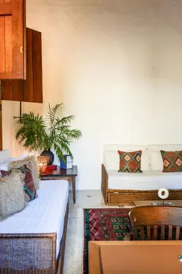 a living room with two beds and a couch at Casa Trujillo in Cartagena de Indias
