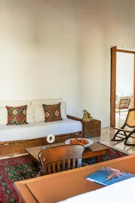 a room with a bed and a table with a pizza at Casa Trujillo in Cartagena de Indias