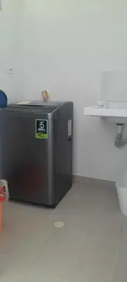 a black refrigerator sitting in a room next to a sink at Apartamento completo con vista a la ciudad in Cartagena de Indias
