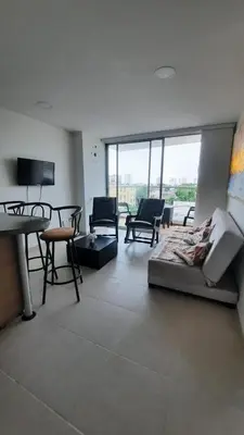 a living room with chairs and a couch and a table at Apartamento completo con vista a la ciudad in Cartagena de Indias