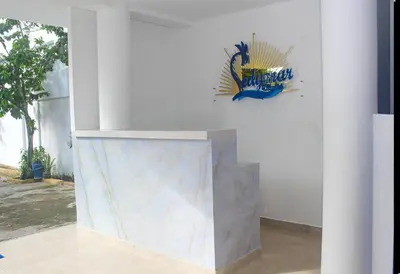 a white wall with a painting on the wall at Chalet Ledymar in Cartagena de Indias