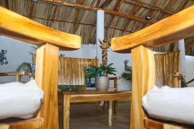 a room with two chairs and a table with a table at Chalet Ledymar in Cartagena de Indias