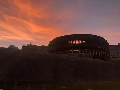 a building with a sunset in the background at Hermoso duplex en la ciudad amurallada! A218 in Cartagena de Indias