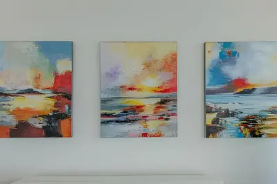 three pieces of art on a white wall at Beachfront Penthouse 40th Sea View/Historic Center in Cartagena de Indias