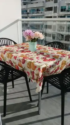 a table with a table cloth with flowers on it at Apartamento con vista directa al mar en Spiaggia di Cartagena in Cartagena de Indias