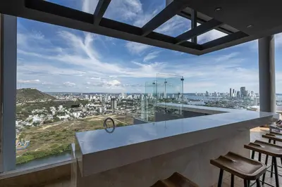 an open kitchen with a view of the city at Cabrero Centro Del Mar - Cerca de la Ciudad Amurallada in Cartagena de Indias