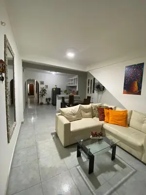 a living room with two couches and a table at Casa lo amador alojamiento entero in Cartagena de Indias