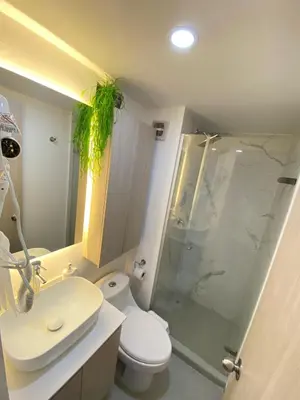a bathroom with a shower and a toilet and a sink at Terrazas Vista al Mar y Piscina Espectacular in Cartagena de Indias