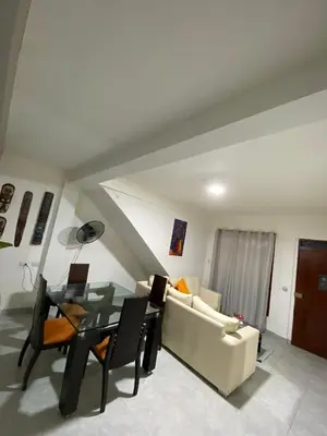 a living room with a couch and a table at Casa alojamiento entero - cerca al castillo san Felipe in Cartagena de Indias