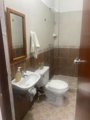 a bathroom with a toilet and a sink at Casa alojamiento entero - cerca al castillo san Felipe in Cartagena de Indias