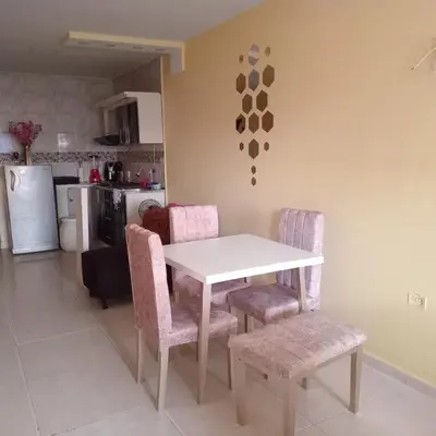 a white table and chairs in a kitchen at comodo apartamento in Barranquilla
