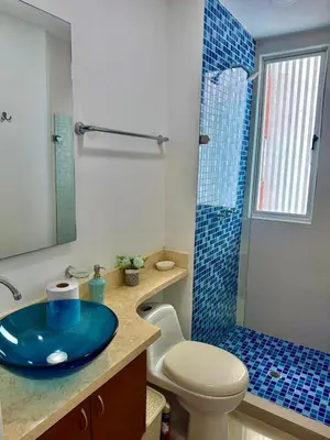 a bathroom with a blue sink and a shower at Apartamento con vista al mar Palmetto in Cartagena de Indias