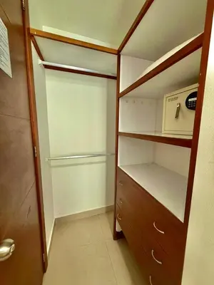 a closet with a wooden cabinet and a microwave at Apartamento con vista al mar Palmetto in Cartagena de Indias