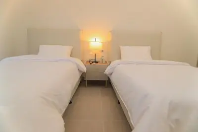 two beds sitting next to each other in a room at Exclusive Apartment With Ocean View By Huespedia in Cartagena de Indias