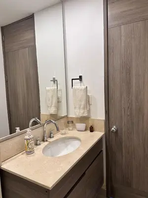 a bathroom with a sink and a large mirror at MC 1303- beach front apt- Morros City top location in Cartagena de Indias