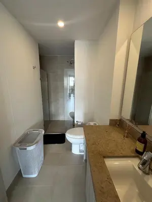 a bathroom with a toilet and a sink at Apartamento Arrecife Golf in Barranquilla