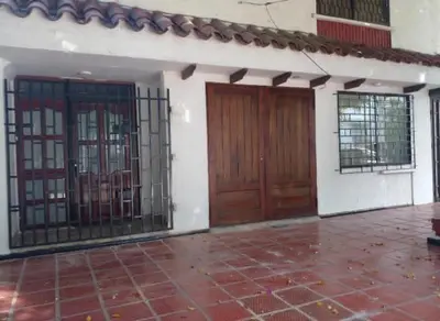 an empty room with two doors and a tile floor at Apartaestudio Ciudad Jardin in Barranquilla