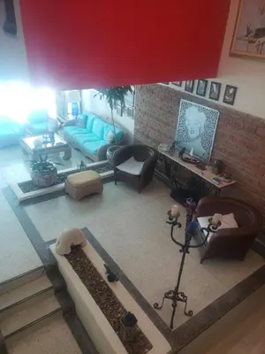 an aerial view of a living room with a blue couch at Vista al Mar in Cartagena de Indias