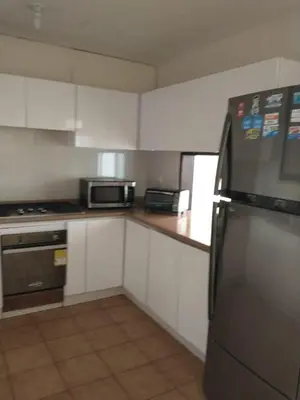 a kitchen with a stainless steel refrigerator and microwave at Vista al Mar in Cartagena de Indias