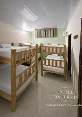 a group of bunk beds in a room at Hotel Don Fermin in Barranquilla