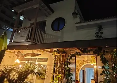 a house with a balcony on the side of it at Hotel Boutique Tierra Del Mar Cartagena in Cartagena de Indias
