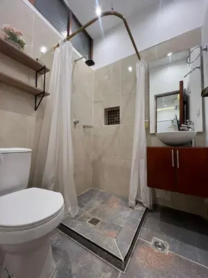 a bathroom with a toilet and a sink and a shower at Cartagena Loft Independiente by Tico in Cartagena de Indias