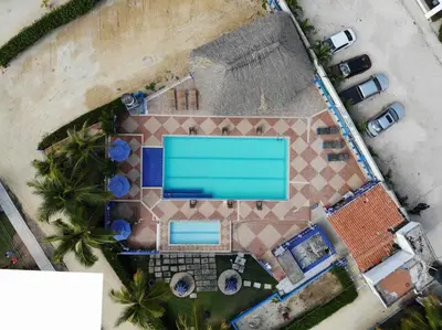 an overhead view of a swimming pool on a resort at Cabaña doña Santi in San Antero
