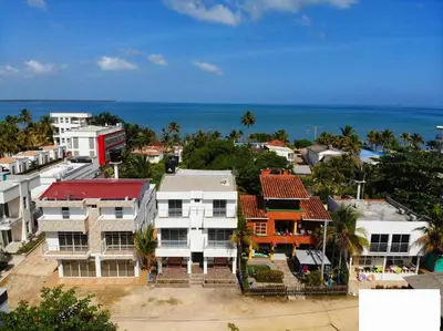 an aerial view of a city with the ocean at Cabaña doña Santi in San Antero