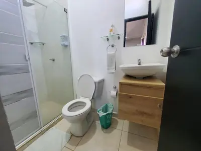 a bathroom with a toilet and a sink and a shower at Apartahotel hm caribe in Santa Marta