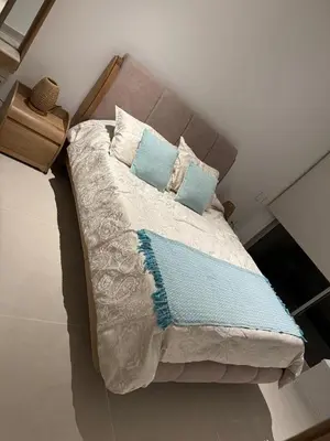 a large bed with two pillows on top of it at Baia Kristal Penthouse Cartagena Playa Artificial Más Grande de Colombia in Cartagena de Indias