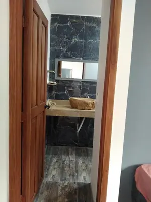 a bathroom with a sink and a counter with a mirror at Cartagena Hotel Boutique - Manga - Tierra del Mar - Colombia in Cartagena de Indias