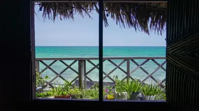 a window view of the ocean from a beach at CARDUMEN ARTE y COCINA in Cartagena de Indias