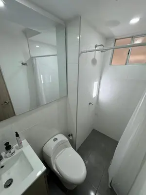 a white bathroom with a toilet and a sink at Apartamento de una habitación en serena del mar en cartagena DAMMAR in Manzanillo del Mar