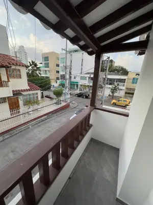 a balcony with a view of a city street at Casa Martina Manga Cartagena in Cartagena de Indias