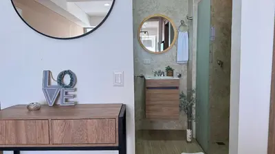 a bathroom with a vanity and a mirror at Loft familiar con balcón y piscina CB840 in Cartagena de Indias